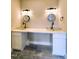 Bathroom featuring double sink with marble countertop and stylish tile flooring at 305 N Webb St, Selma, NC 27576