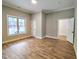 Spacious bedroom with hardwood floors, natural light and ample closet space at 305 N Webb St, Selma, NC 27576