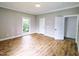 Spacious bedroom featuring hardwood floors, natural light and ample closet space at 305 N Webb St, Selma, NC 27576