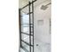 Modern shower showcasing glass door, a rainfall shower head and pebble tile flooring at 305 N Webb St, Selma, NC 27576