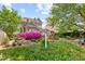 Secluded backyard featuring a fountain, seating area, and lush landscaping at 308 S Pearl St, Rocky Mount, NC 27804