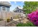 Landscaped backyard with stone patio and garden at 308 S Pearl St, Rocky Mount, NC 27804