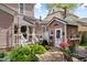 Charming backyard with lush landscaping, patio, and potting shed at 308 S Pearl St, Rocky Mount, NC 27804