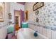 Bathroom featuring floral wallpaper, vintage fixtures, and lots of decor at 308 S Pearl St, Rocky Mount, NC 27804
