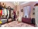 Spacious pink closet with clothing racks, storage, and plush carpet at 308 S Pearl St, Rocky Mount, NC 27804