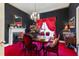 Unique dining room with an ornate chandelier, rich wood table and black walls at 308 S Pearl St, Rocky Mount, NC 27804