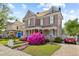 Two-story home with front porch, mature landscaping, and a paved driveway at 308 S Pearl St, Rocky Mount, NC 27804