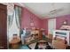 Attic storage area with bright window, stacked boxes and decor at 308 S Pearl St, Rocky Mount, NC 27804