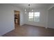 Dining Room with view to a modern kitchen that features stainless steel appliances and light colored cabinetry at 3244 Marcony Way, Raleigh, NC 27610