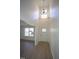 Bright entryway featuring tall ceilings, modern light fixture and a charming front door with glass accents at 3244 Marcony Way, Raleigh, NC 27610