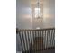 Elegant foyer with wrought iron banister and chandelier, creates a grand and welcoming entrance at 3244 Marcony Way, Raleigh, NC 27610