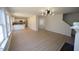 Spacious living room with hardwood floors, neutral paint, and modern lighting at 3244 Marcony Way, Raleigh, NC 27610