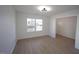 Neutral Living Room with large window providing natural light to a room with light colored walls and flooring at 3244 Marcony Way, Raleigh, NC 27610