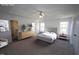 This is a spacious main bedroom featuring plush carpet and large windows at 3244 Marcony Way, Raleigh, NC 27610
