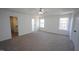 Bright primary bedroom features plush carpet, large windows, and a walk-in closet at 3244 Marcony Way, Raleigh, NC 27610