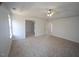 This is a spacious main bedroom featuring plush carpet and large windows at 3244 Marcony Way, Raleigh, NC 27610