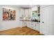 Bar area with custom cabinets, granite countertop, and a wine rack is perfect for entertaining at 3332 Cheswick Dr, Raleigh, NC 27609