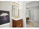 Bathroom featuring a stylish vanity with a striking mirror and modern fixtures at 3332 Cheswick Dr, Raleigh, NC 27609