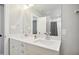 Bathroom with double sinks set in white vanity and large mirror at 3332 Cheswick Dr, Raleigh, NC 27609