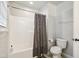 Bathroom showcasing a shower with a modern geometric shower curtain and white tile at 3332 Cheswick Dr, Raleigh, NC 27609