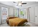Bedroom boasts neutral carpet, a ceiling fan and a door to the outside at 3332 Cheswick Dr, Raleigh, NC 27609