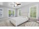 Bedroom boasts natural light, with a ceiling fan and neutral carpeting at 3332 Cheswick Dr, Raleigh, NC 27609