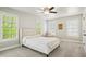 Bedroom boasts natural light, with a ceiling fan and neutral carpeting at 3332 Cheswick Dr, Raleigh, NC 27609
