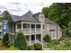Charming two-story home featuring a double porch and manicured landscaping, perfect for Southern living at 3332 Cheswick Dr, Raleigh, NC 27609