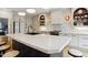 Spacious kitchen boasts a large center island with seating, custom cabinets, and a modern backsplash at 3332 Cheswick Dr, Raleigh, NC 27609