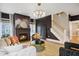 Elegant living room with a fireplace, hardwood floors, and sophisticated decor, ideal for entertaining at 3332 Cheswick Dr, Raleigh, NC 27609