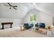 Large living room with plush seating, a foosball table, and neutral carpet at 3332 Cheswick Dr, Raleigh, NC 27609