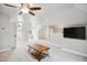 Large living room with plush neutral carpet, ceiling fan, and skylight at 3332 Cheswick Dr, Raleigh, NC 27609