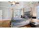 The main bedroom is filled with natural light with a modern bedframe and stylish accents at 3332 Cheswick Dr, Raleigh, NC 27609