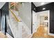 Elegant staircase with carpeted steps, contrasting dark walls, and bright, natural light at 3332 Cheswick Dr, Raleigh, NC 27609