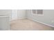 Cozy bedroom featuring neutral carpet and a window with blinds at 361 W Copenhaver Dr, Clayton, NC 27527