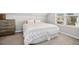 Bedroom features a comfortable bed and a window with a view of the outside at 361 W Copenhaver Dr, Clayton, NC 27527