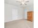Spacious bedroom featuring neutral carpet and a large wooden cabinet and plenty of natural light at 361 W Copenhaver Dr, Clayton, NC 27527