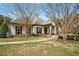 Community clubhouse features beautiful landscaping and a welcoming entrance at 361 W Copenhaver Dr, Clayton, NC 27527