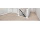 Second floor hallway with neutral carpet leading to bedrooms and bathrooms at 361 W Copenhaver Dr, Clayton, NC 27527