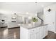 Bright open-concept kitchen features a large island, granite countertops, and seamless flow into the living area at 361 W Copenhaver Dr, Clayton, NC 27527