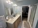Clean bathroom featuring a shower with glass doors, double sinks and vanity with plenty of countertop space at 3954 Piney Grove Church Rd, Siler City, NC 27344