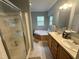 Bright bathroom features a soaking tub, double sink vanity, and walk-in shower at 3954 Piney Grove Church Rd, Siler City, NC 27344