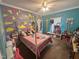 Bright bedroom with unique wall design, plush carpet and plenty of natural light creating a whimsical atmosphere at 3954 Piney Grove Church Rd, Siler City, NC 27344