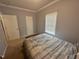 Bedroom features carpet, neutral-colored walls, a window, and a queen bed creating a comfortable atmosphere at 3954 Piney Grove Church Rd, Siler City, NC 27344