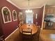 Cozy dining room features a classic table, decorative walls, and plenty of natural light creating a warm atmosphere at 3954 Piney Grove Church Rd, Siler City, NC 27344