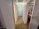 Hallway features carpet, neutral-colored walls, and doorway views into other areas creating a connected feel at 3954 Piney Grove Church Rd, Siler City, NC 27344