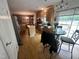 Eat-in kitchen has wood floors, kitchen island, and matching appliances in a casual dining space at 3954 Piney Grove Church Rd, Siler City, NC 27344