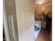 Convenient laundry room with washer, dryer, storage shelves, and ample space for sorting and folding clothes at 3954 Piney Grove Church Rd, Siler City, NC 27344