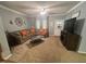Comfortable living room features a plush sectional sofa, ceiling fan, and neutral décor for a cozy atmosphere at 3954 Piney Grove Church Rd, Siler City, NC 27344
