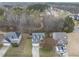 Aerial view of a neighborhood with mature trees and well-maintained homes at 416 Collinsworth Dr, Clayton, NC 27527